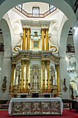 The embossed silver main altar & main altarpiece in the Basilica of Our Lady of Candelaria, Medellin, Colombia.
