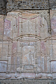 Detail of the stucco wall of the nymphaeum of the Stabian Baths in the ancient Roman ruins of Pompeii, Italy.