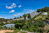 Sun shade structures protect sensitive crops in the agricultural land around Guatape, Colombia.
