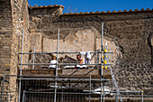 Archeologists work to restore and stabilize the ancient Roman ruins of Pompeii in Italy.