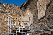 Archeologists work to restore and stabilize the ancient Roman ruins of Pompeii in Italy.