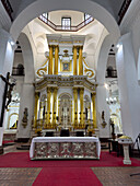 The embossed silver main altar & main altarpiece in the Basilica of Our Lady of Candelaria, Medellin, Colombia.