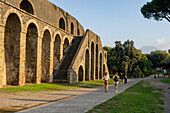The exterior of the Amphitheater of Pompeii in the ancient Roman ruins of Pompeii in Italy.