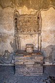 Household shrine in the House of the Geometric Mosaics, Building VIII.2.16, in the ancient Roman ruins of Pompeii, Italy.