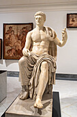 A 1st Century marble statue of the Emperor Claudius in the National Archaeological Museum of Naples, Naples, Italy.