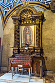 A painting of the Virgin Mary in an altarpiece of the Church of Santo Domingo in Quito, Ecuador.