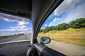Cruising through Seville, Andalusia, vibrant skies and golden fields create breathtaking scenery all around.