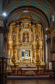 The main altarpiece in the El Sagrario Church, part of the Metropolitan Cathedral complex, in Quito, Ecuador.
