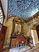A painting of the Virgin Mary in an altarpiece of the Church of Santo Domingo in Quito, Ecuador.