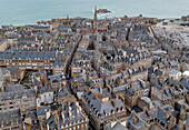 Aerial view of historic medieval architecture and picturesque rooftops overlooking the sea, Saint Malo, Ille-et-Vilaine, France.