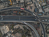 Aerial view of bustling urban infrastructure with dense traffic and highways, Jatrabari Thana, Dhaka, Bangladesh.