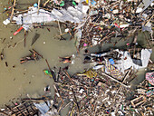 Aerial view of a destroyed fishing village with debris and wreckage after cyclone Sitrang, Potenga, Chittagong, Bangladesh.