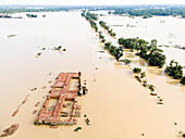Aerial view of a flooded village with submerged buildings and roads, Chhagalnaiya, Feni, Chittagong, Bangladesh.