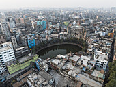 Aerial view of Sadar Ghat and Gol Talab with dense urban landscape and high-rise buildings, Dhaka Kotwali Thana, Dhaka, Bangladesh.