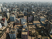 Aerial view of crowded urban skyline with modern high-rise buildings and residential areas, Mohammadpur Upazila, Dhaka, Bangladesh.