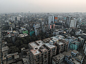 Aerial view of bustling urban landscape with high-rise buildings and dense skyline, Gendaria, Dhaka, Bangladesh.