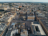 Aerial view of historic town square surrounded by beautiful old buildings and urban landscape, Lecce, Lecce, Italy.