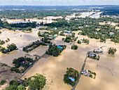 Aerial view of flooded village with submerged homes and fields, Chhagalnaiya, Feni, Chittagong, Bangladesh.