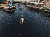 Keraniganj, Bangladesh - 30 January 2025: Aerial view of busy Sadar Ghat with traditional boats and vibrant activity along the Buriganga River, Subhadya, Keraniganj, Dhaka, Bangladesh.