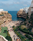 Aerial view of picturesque old town with beautiful architecture and cliffs by the Mediterranean Sea, Polignano a Mare, Bari, Italy.