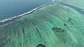 Aerial view of beautiful turquoise reef in the ocean, Western, Fiji.