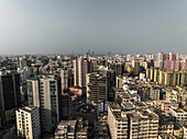 Aerial view of vibrant downtown cityscape with high-rise buildings and bustling streets, Paltan Thana, Dhaka, Bangladesh.