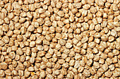 Top view of a full frame of fresh raw chickpeas, providing a natural texture and pattern, ideal for food backgrounds.