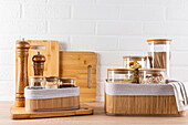 A stylish set of wooden kitchen accessories on a pristine white background, perfect for modern interior design themes.