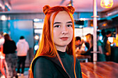 A red-haired woman visits a bustling Asian food market, surrounded by bright colours and various dishes She explores different stalls in a lively atmosphere
