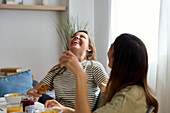 A happy lesbian couple enjoy a carefree breakfast together, emphasising the love and happiness in their daily lives A beautiful moment of pride and connection
