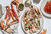 Delicious crab legs, garnished with fresh herbs and garlic, form the centrepiece of this delicious dish. Paired with white wine, this gourmet dish is both visually and flavourfully appealing