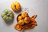 Pumpkin roll yeast bread with spices on a linen background. Thanksgiving food concept. Autumn concept, top view, Halloween
