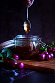 Australian Lilly-Pilly-Riberry jam against a black background.