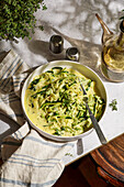 Creamy garlic and courgette noodles (zoodles), served as a healthy, low-carb pasta alternative