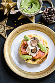 Appetiser with smoked salmon, avocado cream and truffle