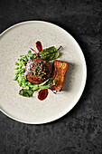 Eye fillet, truffle gratin, portobello mushroom crust, pea and pecorino puree, sorrel leaves