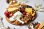 Californian cheese platter with fruit, crackers and olives