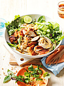 Thai salad bowl with satay chicken and soba noodles