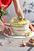 Strawberry cake with spring flower decoration