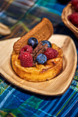 Japanese cheesecake with berries and biscuits