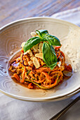 Spaghetti with red almond pesto