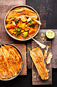 Vegan vegetable curry with flaky coconut crust