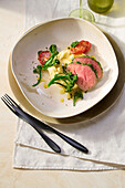 Fillet of beef in lemon oil on aligot with broccoli sprouts