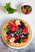 Soft tart with cream and wild berries