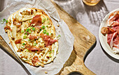 Tarte flambée with pear, walnuts and goat's cheese