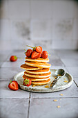 Pancake tower with strawberries and honey