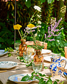 Festive table decoration with outdoor flower arrangement