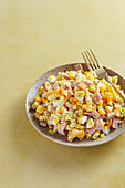 Curry pasta salad with boiled ham, gherkins and mayo