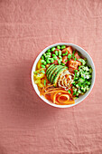 Poke bowl with rice noodles, salmon, edamame and avocado