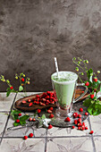 Matcha latte with wild strawberries